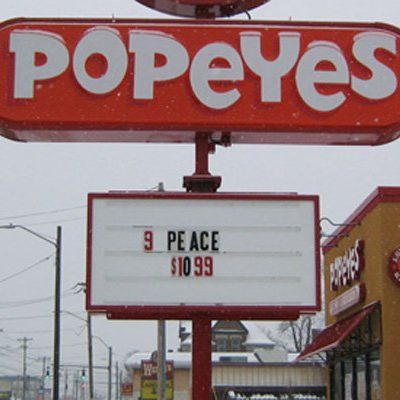 Fast food sign with piece spelled as peace